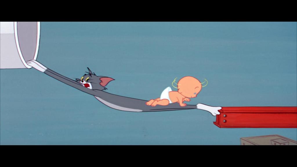 A cartoon scene depicting "Cartoon Baby" crawling across a precarious gap high above a city. Tom the cat is stretched thin like a hammock, anchored to a white pipe on one side and a red I-beam on the other, acting as a safety net. Tom has a panicked expression, illustrating the frantic effort to keep the oblivious baby safe
